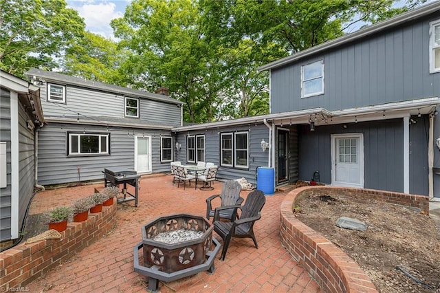 1414 Henri St, Mount Airy, NC 27030 - rear view of property featuring an outdoor fire pit and a patio