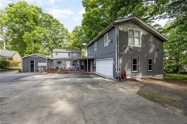 1414 Henri St, Mount Airy, NC 27030 - view of property exterior featuring asphalt driveway and a garage