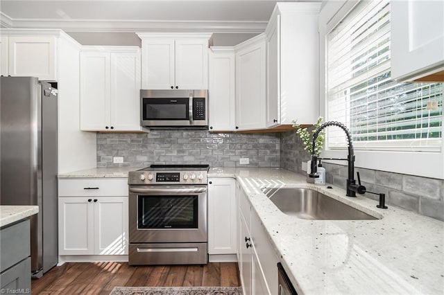 7634 Grapevine Rd, Lewisville, NC 27023 - kitchen featuring crown molding, a sink, white cabinetry, and appliances with stainless steel finishes