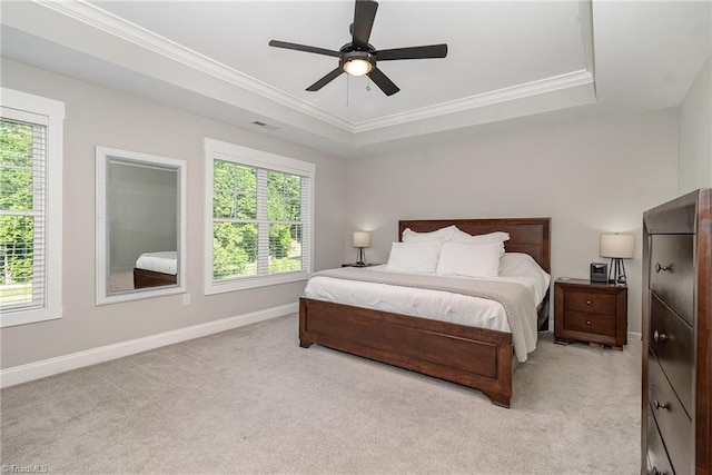 7634 Grapevine Rd, Lewisville, NC 27023 - bedroom with ceiling fan, light colored carpet, crown molding, baseboards, and a raised ceiling