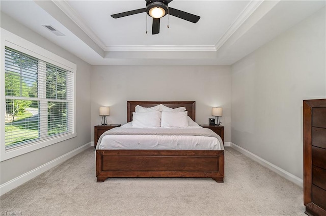 7634 Grapevine Rd, Lewisville, NC 27023 - bedroom with crown molding, light colored carpet, a tray ceiling, and visible vents
