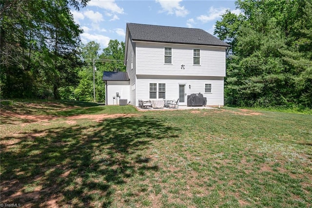 7634 Grapevine Rd, Lewisville, NC 27023 - back of property with a patio area, a yard, and cooling unit