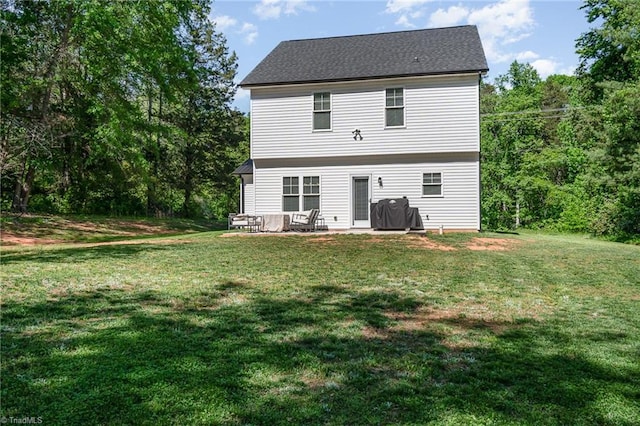 7634 Grapevine Rd, Lewisville, NC 27023 - back of property featuring a yard and a patio area
