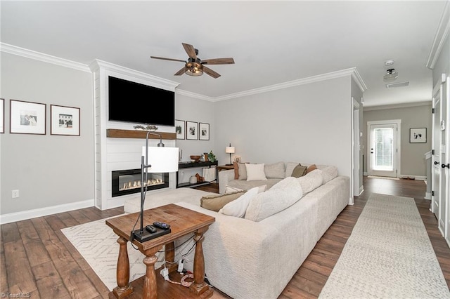 7634 Grapevine Rd, Lewisville, NC 27023 - living area with crown molding, baseboards, a ceiling fan, and dark wood-style floors