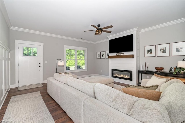7634 Grapevine Rd, Lewisville, NC 27023 - living room featuring crown molding, a large fireplace, a ceiling fan, and dark wood finished floors