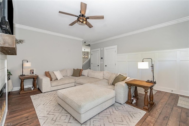 7634 Grapevine Rd, Lewisville, NC 27023 - living room featuring wainscoting, a ceiling fan, ornamental molding, and dark wood-type flooring