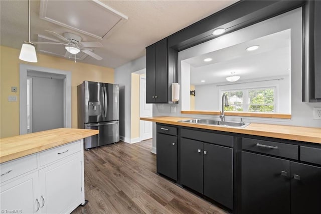 3231 Arlington Dr, Winston-Salem, NC 27103 - kitchen featuring butcher block counters, stainless steel fridge, dark wood-style flooring, white cabinets, and recessed lighting