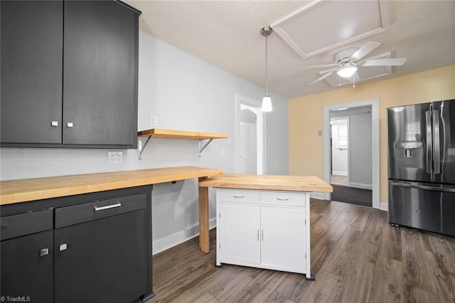 3231 Arlington Dr, Winston-Salem, NC 27103 - kitchen with stainless steel refrigerator with ice dispenser, butcher block counters, a ceiling fan, dark wood-style flooring, and white cabinetry