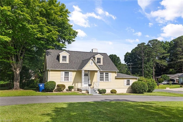 3231 Arlington Dr, Winston-Salem, NC 27103 - cape cod-style house with a front yard, a chimney, and a shingled roof