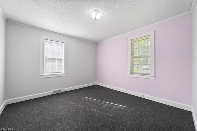 3231 Arlington Dr, Winston-Salem, NC 27103 - spare room featuring ornamental molding, a textured ceiling, and dark carpet