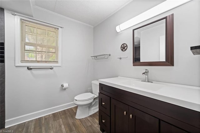 3231 Arlington Dr, Winston-Salem, NC 27103 - bathroom with crown molding, wood finished floors, vanity, and a textured ceiling