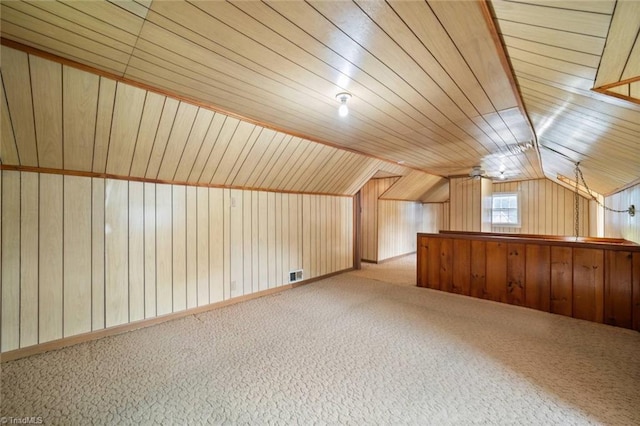 3231 Arlington Dr, Winston-Salem, NC 27103 - additional living space featuring carpet flooring, lofted ceiling, and wood walls
