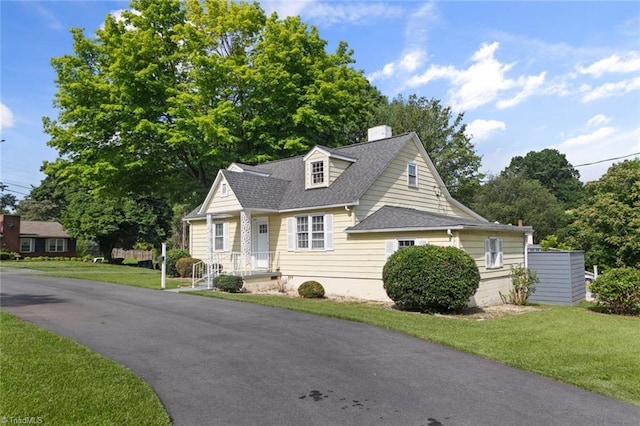 3231 Arlington Dr, Winston-Salem, NC 27103 - view of front facade featuring a shingled roof, a chimney, and a front lawn