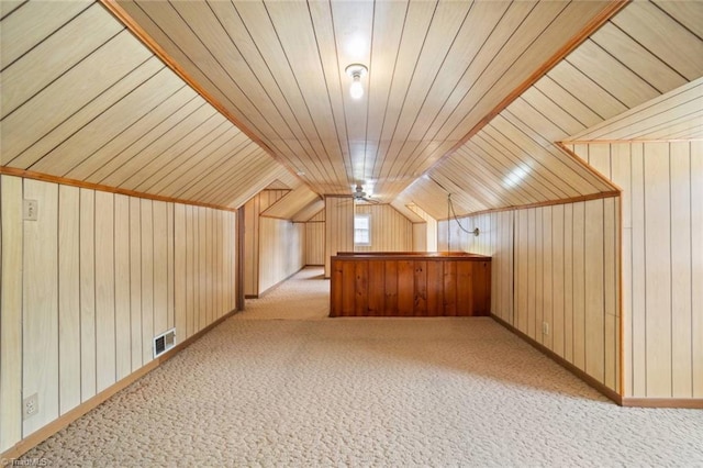 3231 Arlington Dr, Winston-Salem, NC 27103 - additional living space featuring light carpet, wooden walls, and vaulted ceiling