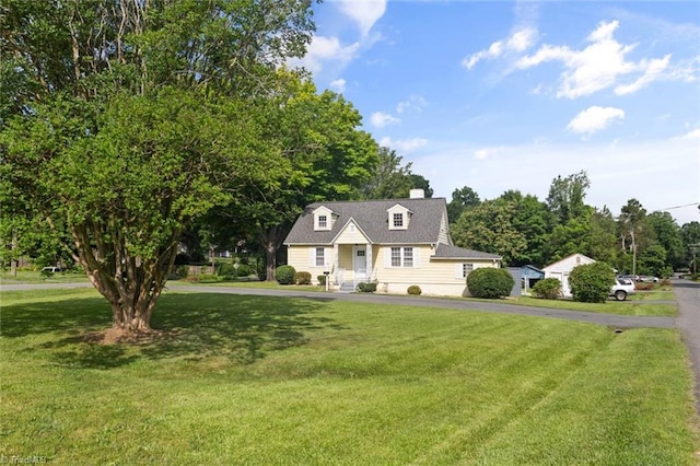 3231 Arlington Dr, Winston-Salem, NC 27103 - new england style home featuring a front yard and a chimney