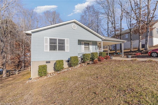 view of side of property featuring a yard and a porch