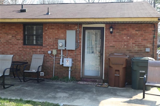 entrance to property featuring a patio area