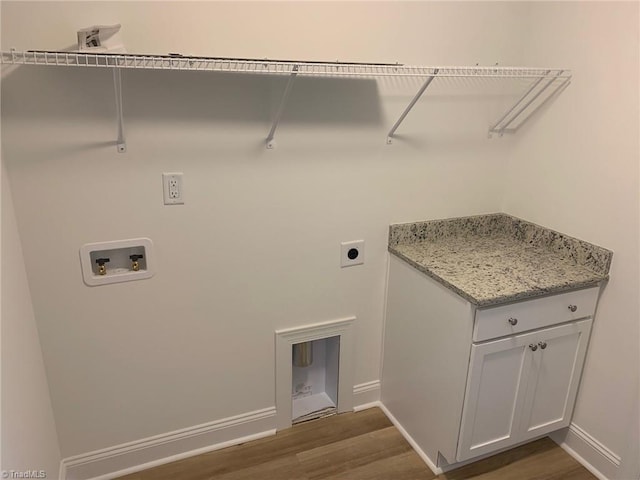 washroom with hookup for an electric dryer, hookup for a washing machine, and dark hardwood / wood-style floors