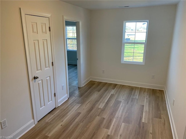 spare room with light wood-type flooring