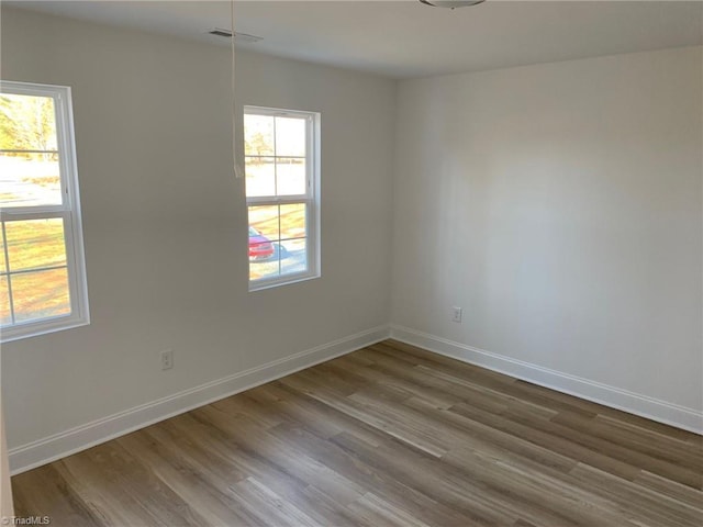 empty room with wood-type flooring