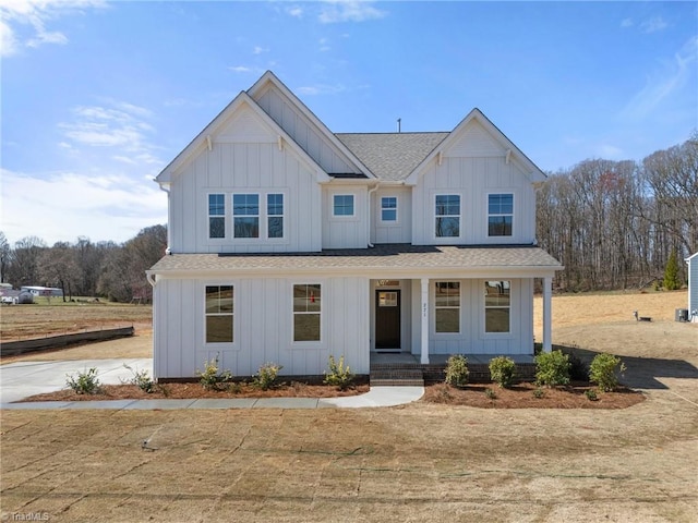 271 Redland Rd, Advance, NC 27006 - modern inspired farmhouse featuring board and batten siding, covered porch, and a shingled roof