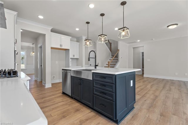 271 Redland Rd, Advance, NC 27006 - kitchen featuring appliances with stainless steel finishes, white cabinetry, light wood-style flooring, light countertops, and recessed lighting