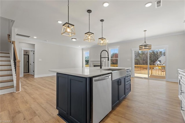 271 Redland Rd, Advance, NC 27006 - kitchen with stainless steel dishwasher, light countertops, plenty of natural light, crown molding, and light wood finished floors