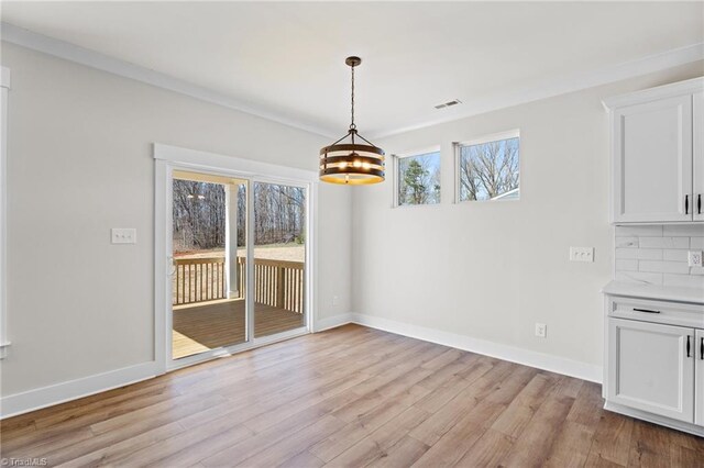 271 Redland Rd, Advance, NC 27006 - unfurnished dining area with a chandelier and light wood-type flooring