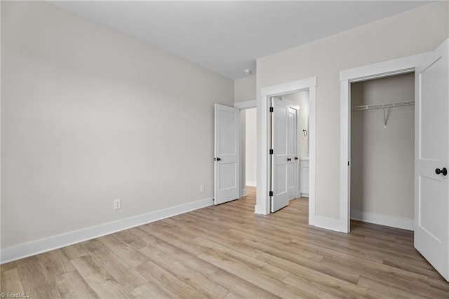 271 Redland Rd, Advance, NC 27006 - unfurnished bedroom featuring light wood-style flooring and a closet