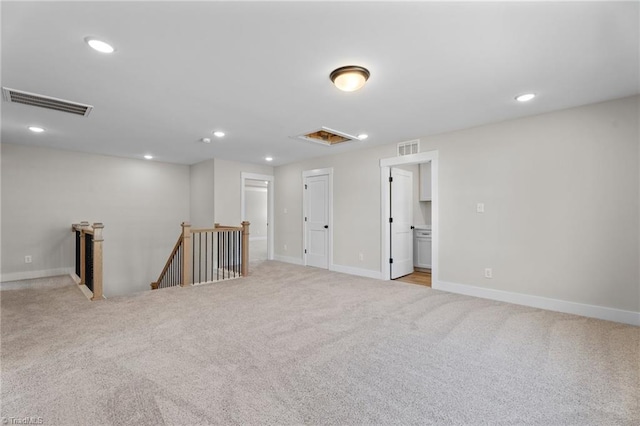 271 Redland Rd, Advance, NC 27006 - spare room with light colored carpet, recessed lighting, and attic access