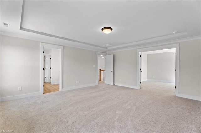 271 Redland Rd, Advance, NC 27006 - unfurnished bedroom with light colored carpet, a raised ceiling, and crown molding