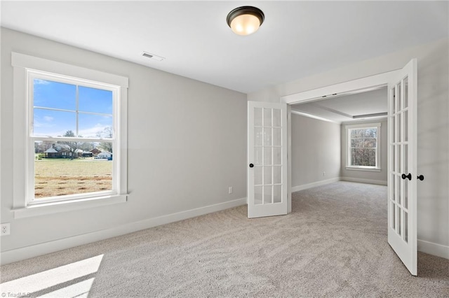 271 Redland Rd, Advance, NC 27006 - carpeted spare room featuring french doors and baseboards