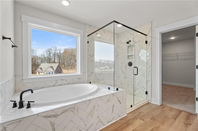 271 Redland Rd, Advance, NC 27006 - full bathroom with a bath, a marble finish shower, healthy amount of natural light, a spacious closet, and recessed lighting
