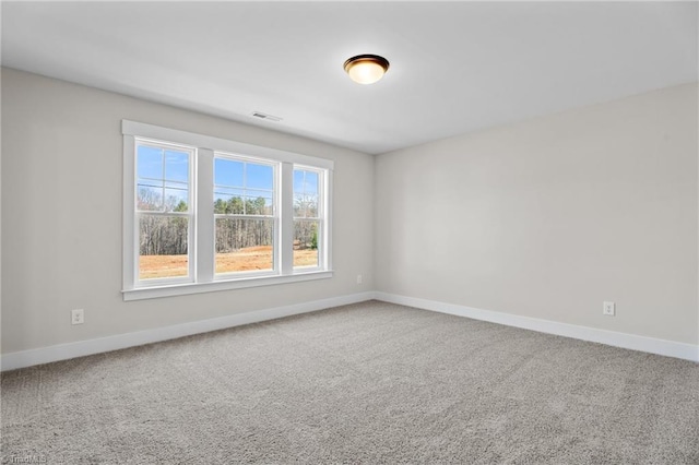 271 Redland Rd, Advance, NC 27006 - spare room featuring baseboards and carpet floors