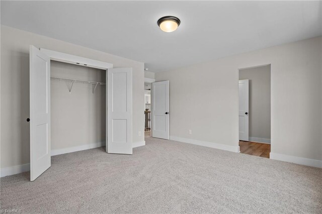 271 Redland Rd, Advance, NC 27006 - unfurnished bedroom featuring carpet and a closet