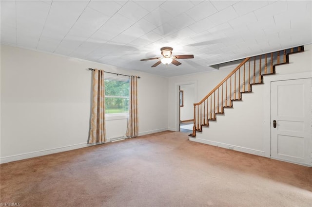 interior space with ceiling fan