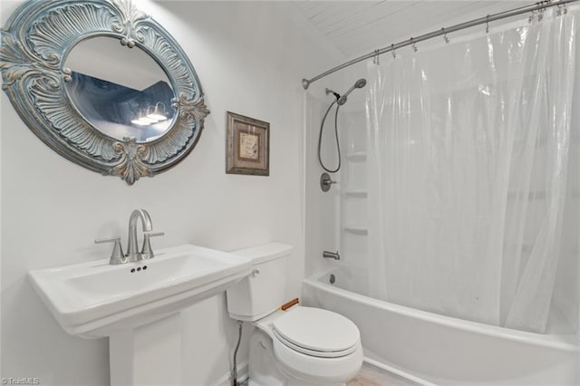 full bathroom featuring toilet, sink, and shower / bath combination with curtain