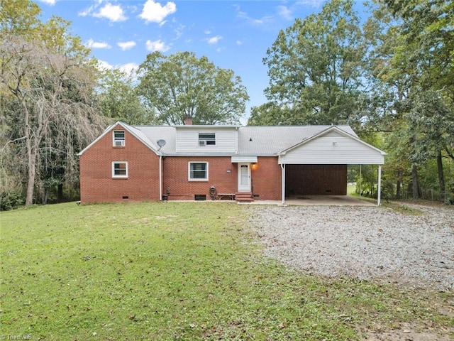 view of front facade featuring a carport and a front yard