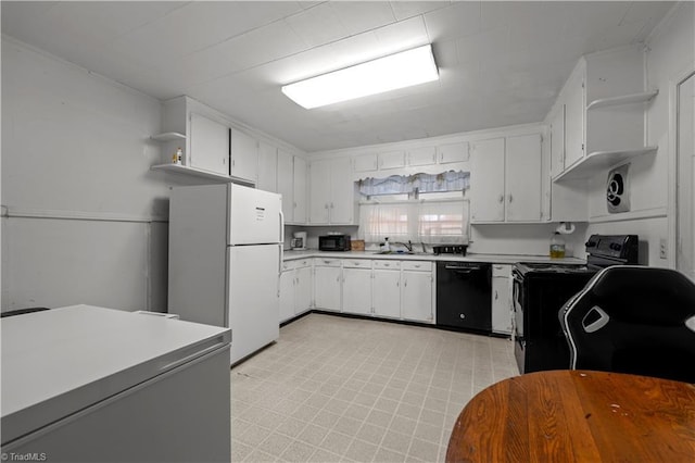 kitchen with sink, white cabinets, and black appliances