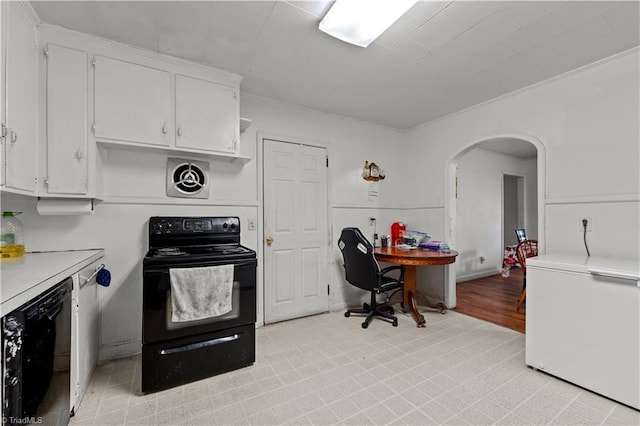 kitchen with black appliances, white cabinetry, and light hardwood / wood-style flooring