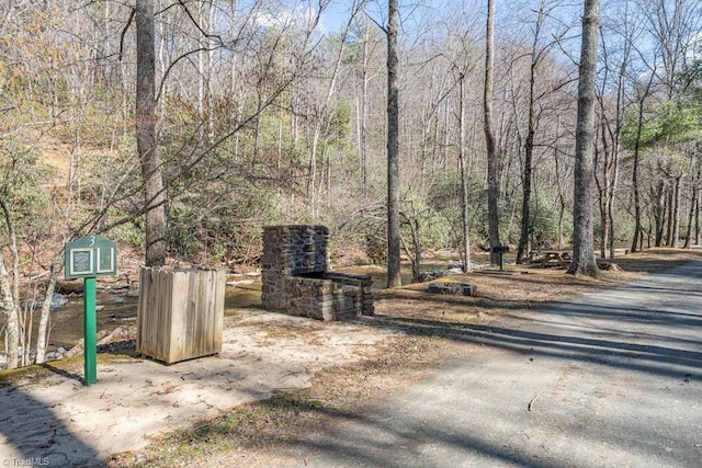 exterior space with a wooded view