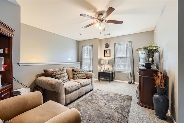 living room with ceiling fan and light carpet