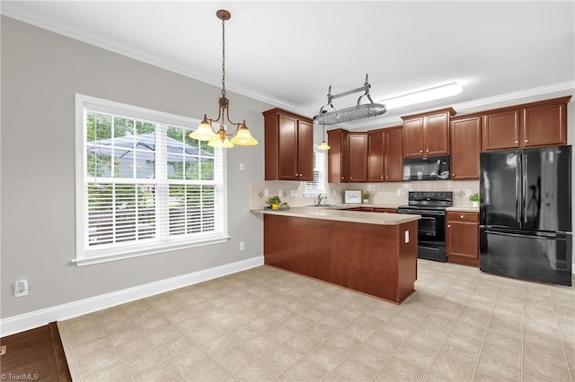 6107 Hanes Way, Clemmons, NC 27012 - kitchen with black appliances, crown molding, light countertops, a peninsula, and pendant lighting