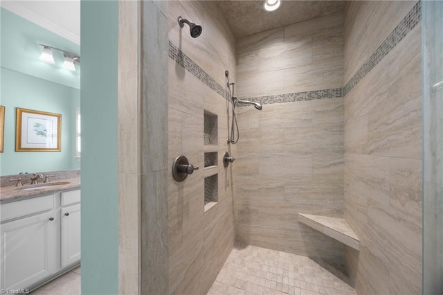 full bath with vanity and tiled shower