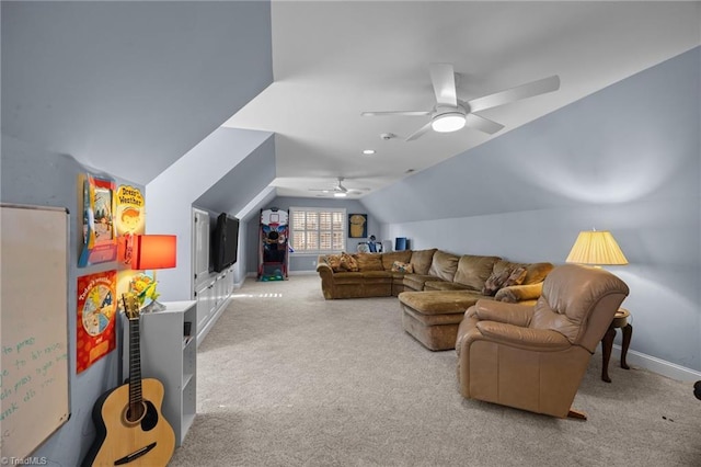living area featuring vaulted ceiling, carpet flooring, baseboards, and a ceiling fan