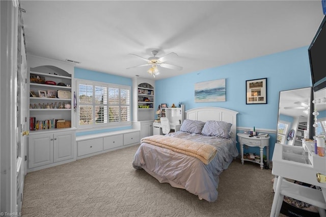 bedroom featuring visible vents, a ceiling fan, and carpet floors