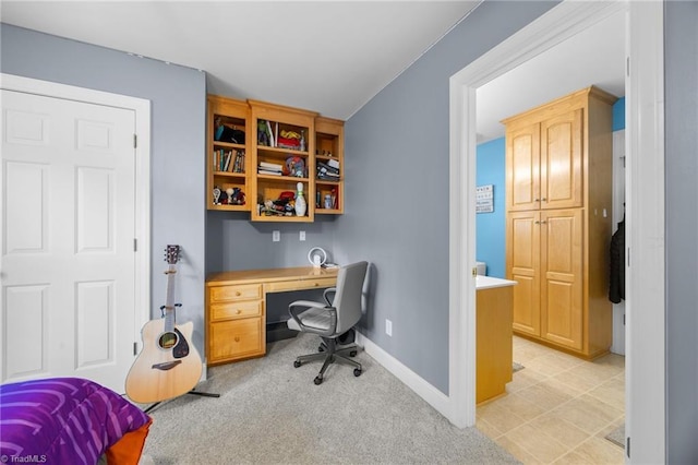 office with light colored carpet and baseboards