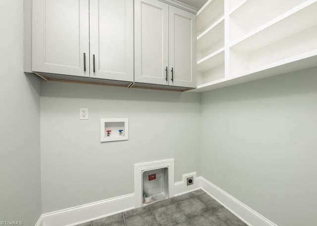 clothes washing area featuring electric dryer hookup, cabinets, and hookup for a washing machine