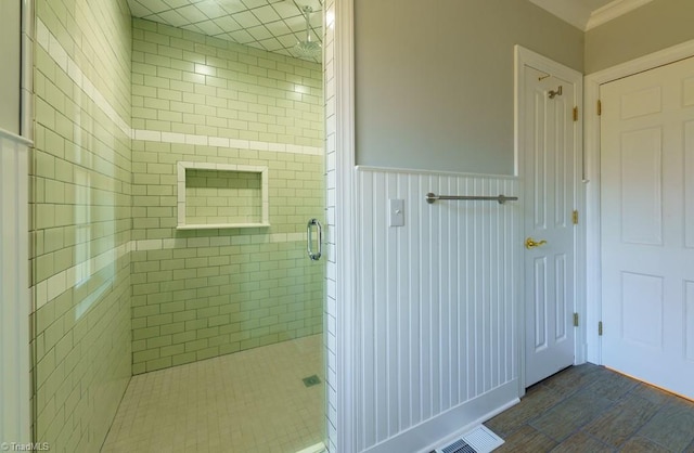 bathroom with tile patterned floors and a shower with shower door