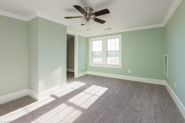 unfurnished room with carpet, ceiling fan, and crown molding